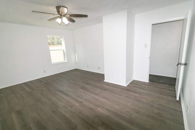 spare room with ceiling fan, dark hardwood / wood-style flooring, and a textured ceiling