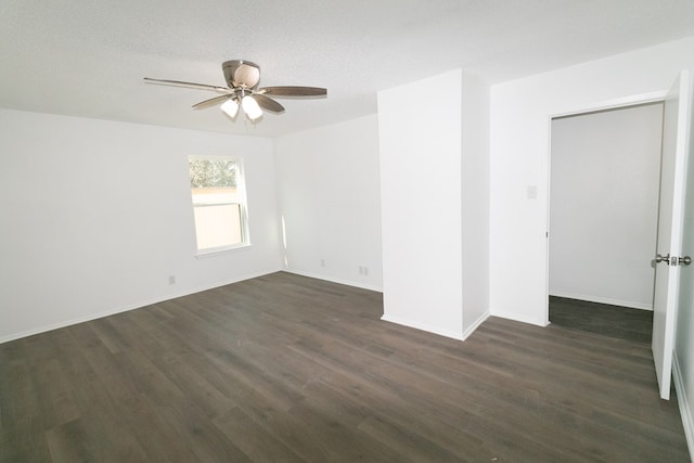 spare room featuring a textured ceiling, dark hardwood / wood-style flooring, and ceiling fan