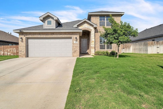 4107 Connally St, Big Spring, TX 79720 - traditional home with brick siding, concrete driveway, and an attached garage