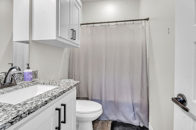 4107 Connally St, Big Spring, TX 79720 - full bathroom with vanity and wood finished floors