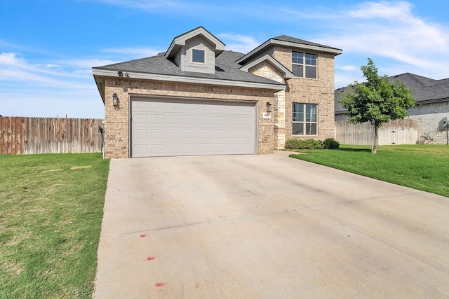 4107 Connally St, Big Spring, TX 79720 - traditional home featuring driveway, brick siding, an attached garage, and roof with shingles