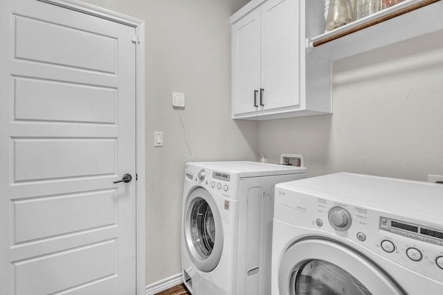 4107 Connally St, Big Spring, TX 79720 - laundry area featuring separate washer and dryer and cabinet space