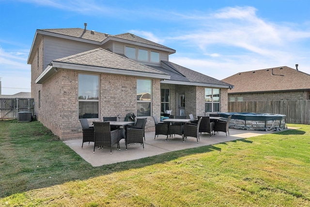 4107 Connally St, Big Spring, TX 79720 - rear view of property with a fenced backyard, a patio, and brick siding