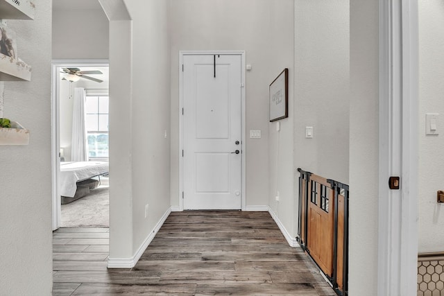 4107 Connally St, Big Spring, TX 79720 - entryway with arched walkways, wood finished floors, and a ceiling fan