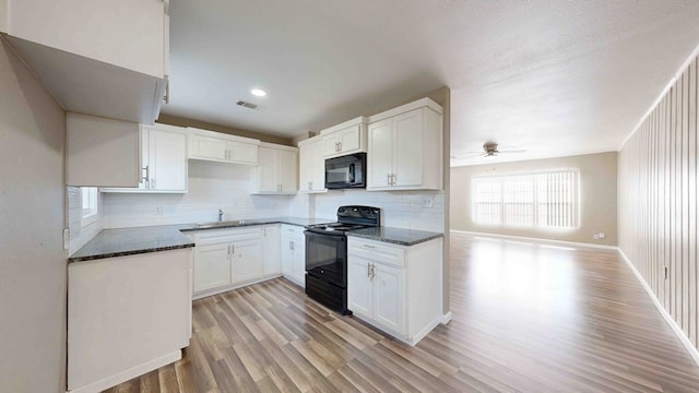 kitchen featuring white cabinets, light wood-type flooring, ceiling fan, and black appliances