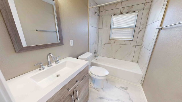 full bathroom with vanity, toilet, and tiled shower / bath