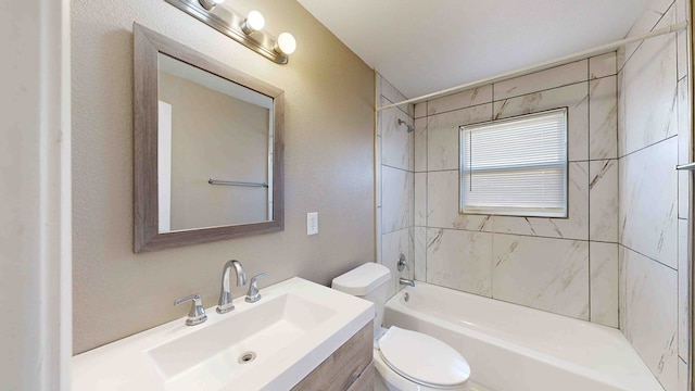 full bathroom with vanity, toilet, and tiled shower / bath