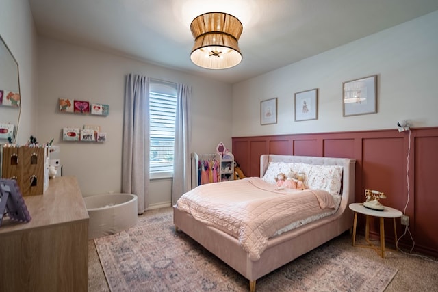 5607 Camino Reale, Midland, TX 79707 - carpeted bedroom featuring wainscoting