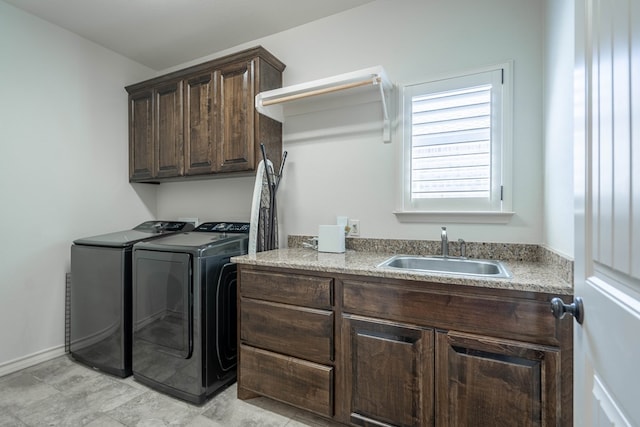 5607 Camino Reale, Midland, TX 79707 - washroom featuring washer and dryer and cabinet space