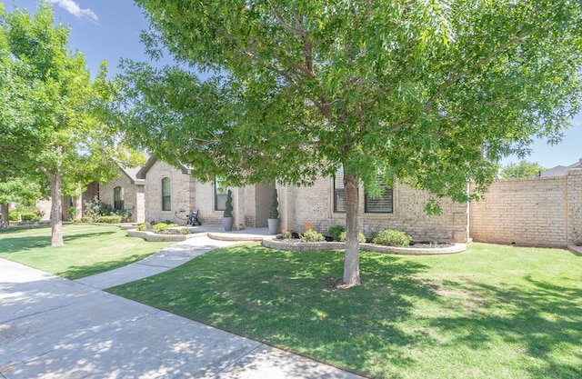 5607 Camino Reale, Midland, TX 79707 - view of property hidden behind natural elements with brick siding