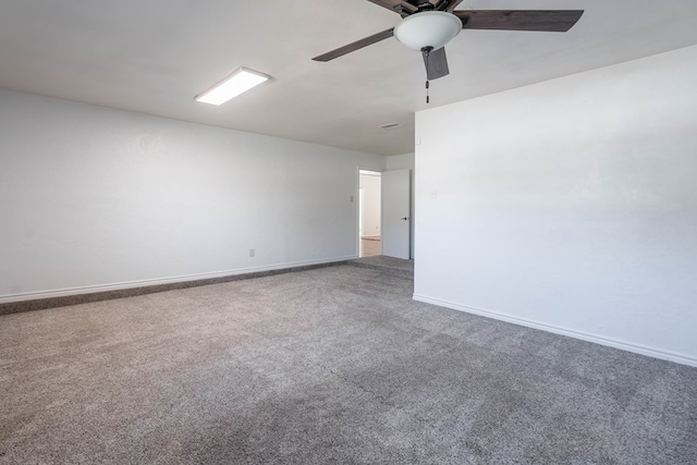 unfurnished room featuring ceiling fan, baseboards, and carpet