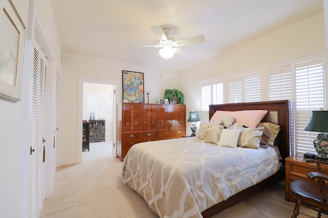 bedroom with ceiling fan and light carpet