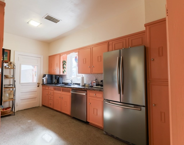 kitchen featuring tasteful backsplash, sink, and stainless steel appliances