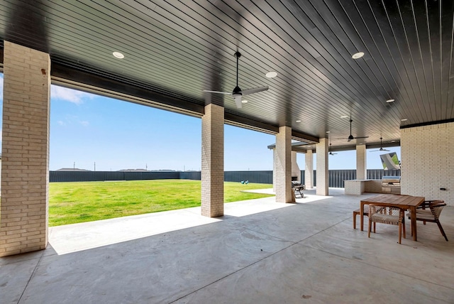 view of patio featuring a ceiling fan, outdoor dining space, and a fenced backyard