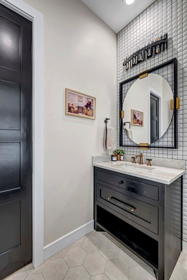 bathroom featuring vanity and baseboards