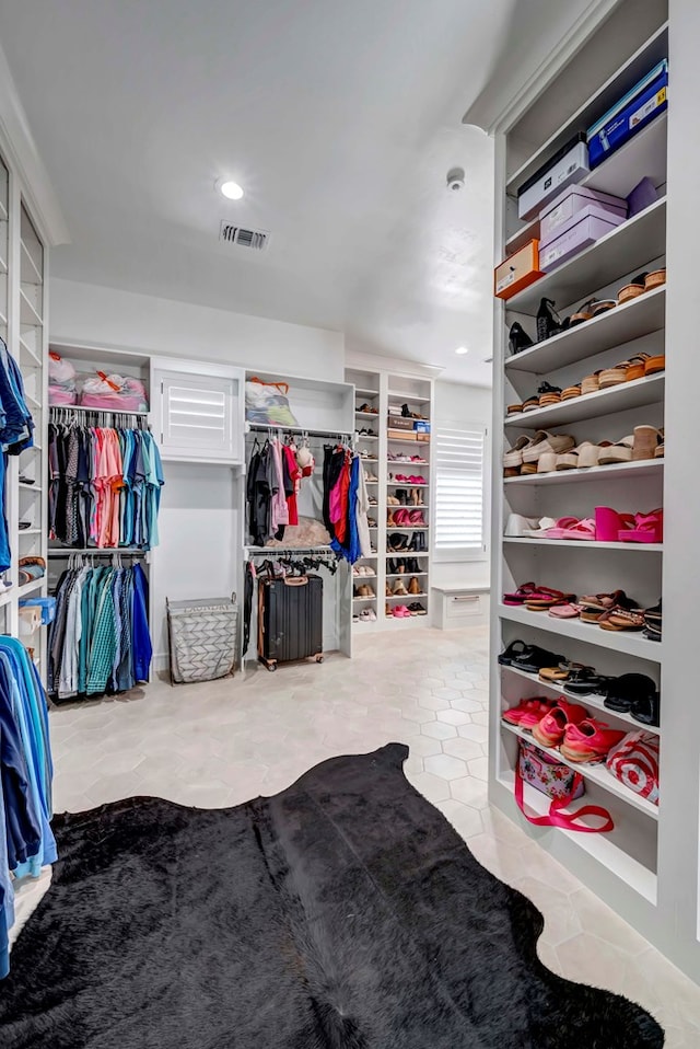 walk in closet with visible vents and tile patterned flooring