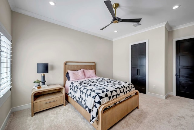 bedroom with light carpet, crown molding, visible vents, and baseboards