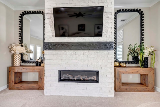 details featuring a fireplace, crown molding, visible vents, and carpet