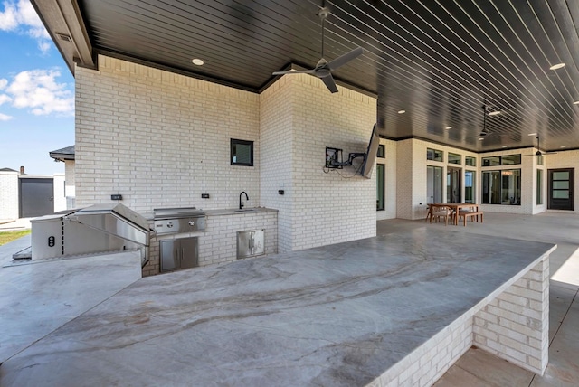 view of patio with a ceiling fan, a sink, area for grilling, grilling area, and outdoor dining area