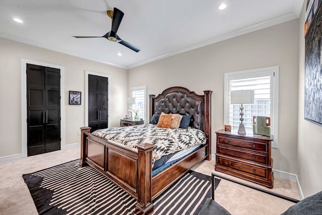 bedroom featuring recessed lighting, light carpet, crown molding, and baseboards