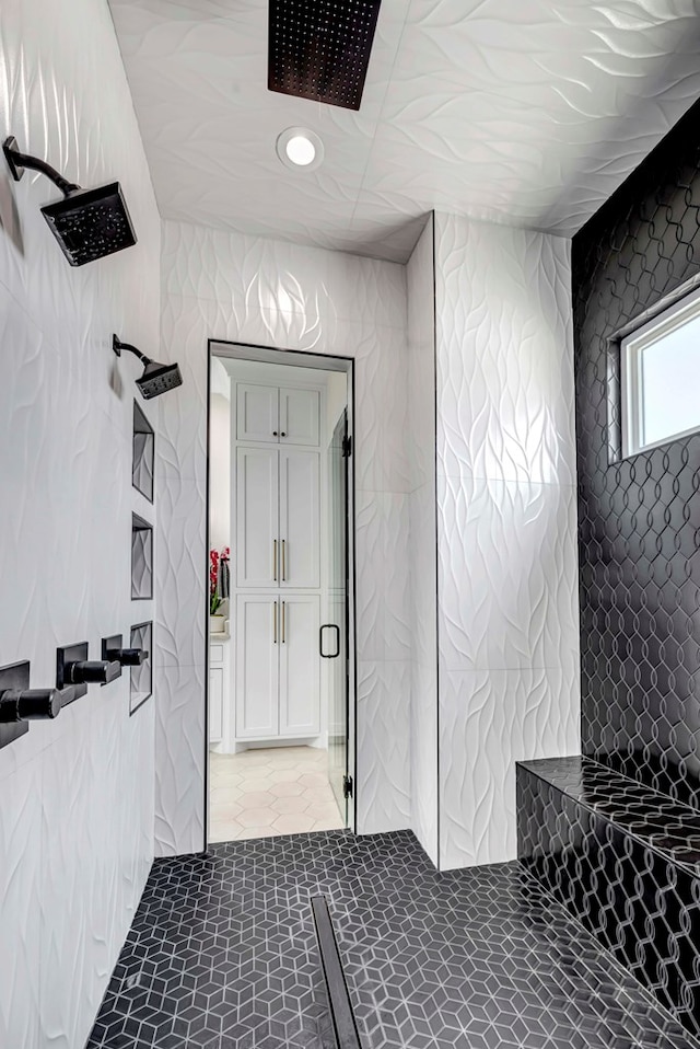 full bath featuring a tile shower