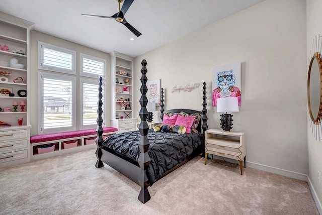 bedroom with ceiling fan, baseboards, and light carpet