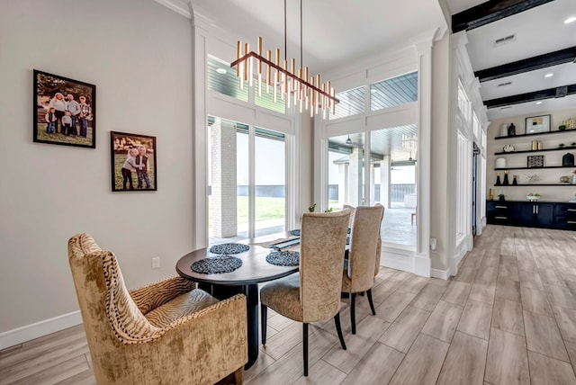 dining space with recessed lighting, visible vents, light wood-style floors, beam ceiling, and baseboards