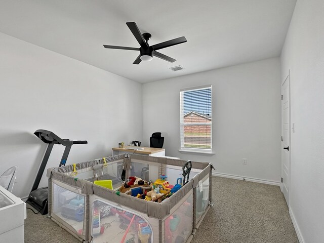 bedroom featuring light carpet and ceiling fan