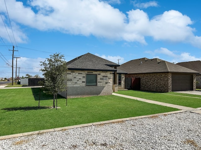 ranch-style house with a garage and a front lawn