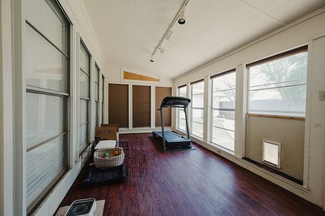 3903 Bedford Ave, Midland, TX 79703 - exercise area featuring rail lighting, wood finished floors, and vaulted ceiling