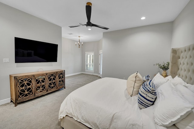 carpeted bedroom with recessed lighting, baseboards, and ceiling fan with notable chandelier