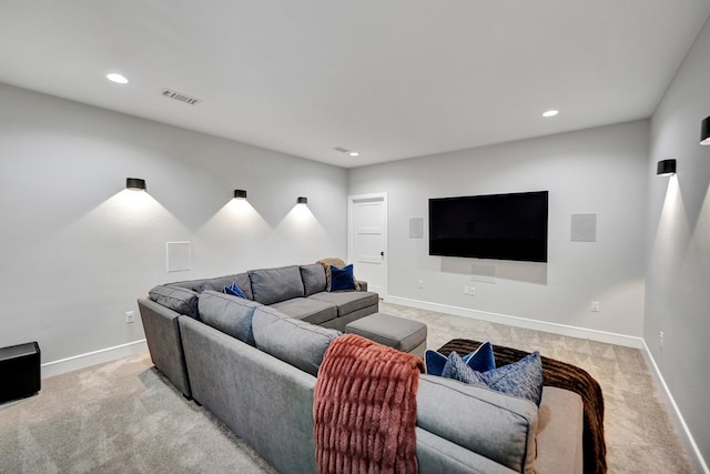 living area with recessed lighting, visible vents, light carpet, and baseboards