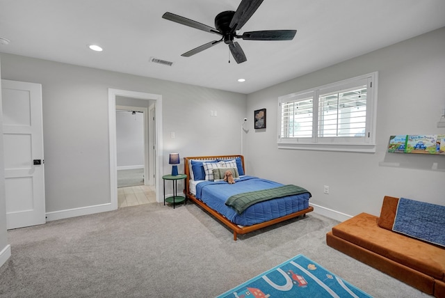 carpeted bedroom featuring ceiling fan, recessed lighting, visible vents, and baseboards