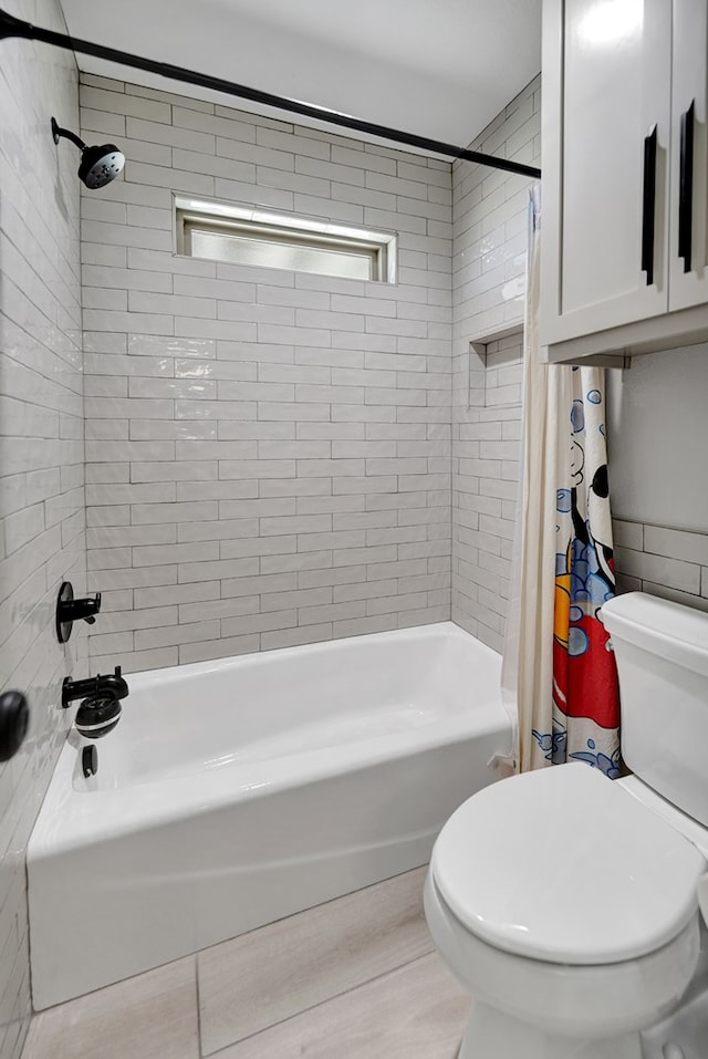 full bath with toilet and shower / tub combo with curtain