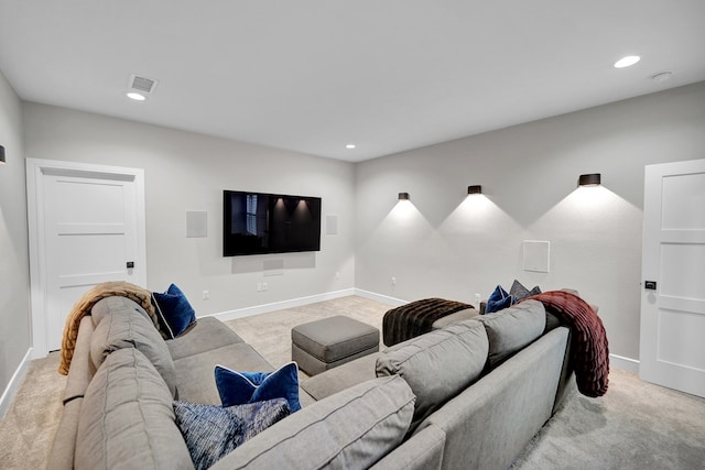 living room with light colored carpet, visible vents, and baseboards