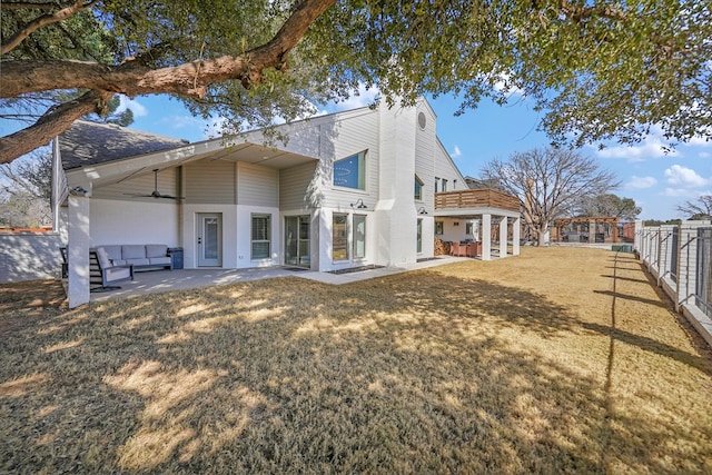 back of house with a ceiling fan, a yard, fence, and a patio