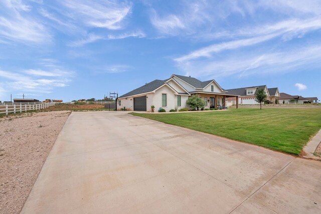 single story home with a garage, driveway, fence, and a front lawn