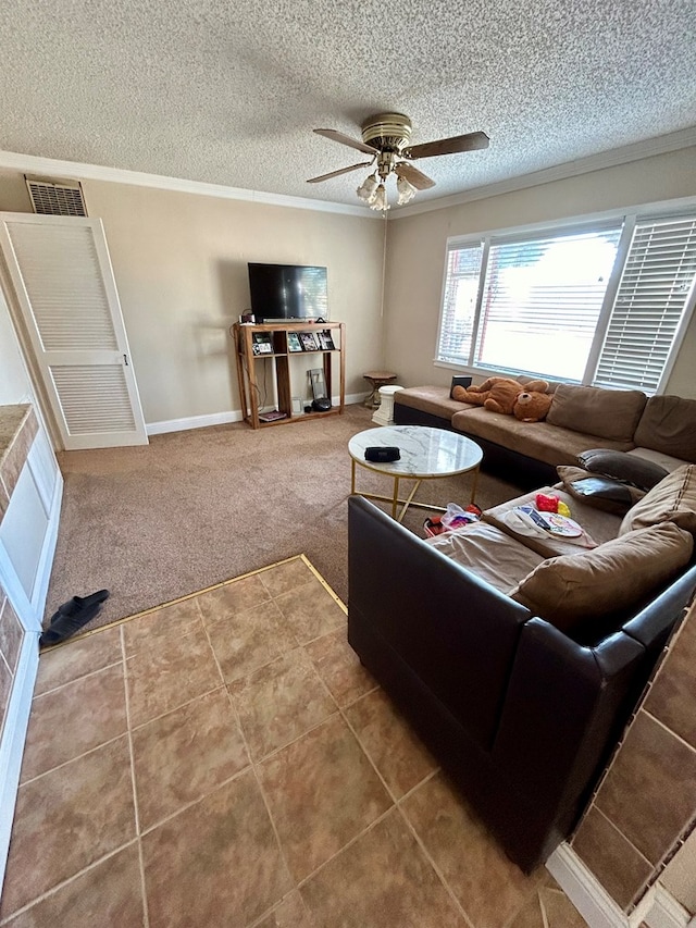 tiled living room featuring a textured ceiling, ceiling fan, and ornamental molding