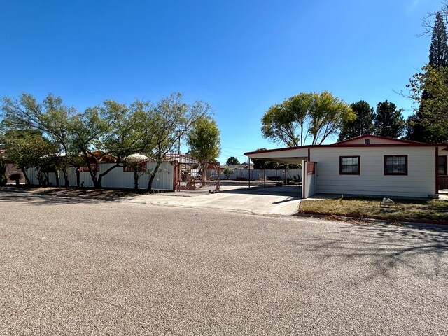 view of front of home with a carport