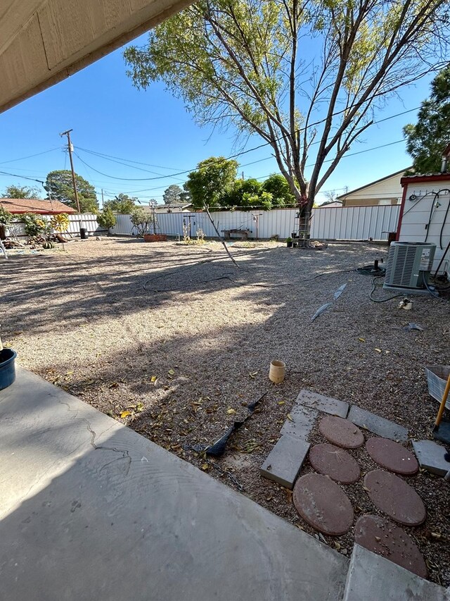 view of yard featuring central AC unit