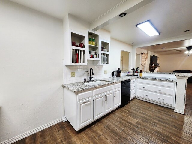 2824 Cimmaron Ave, Midland, TX 79705 - kitchen with a sink, black appliances, light stone countertops, backsplash, and dark wood finished floors