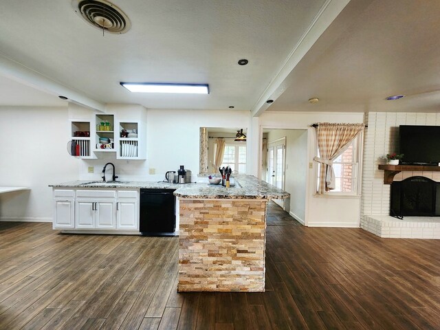 2824 Cimmaron Ave, Midland, TX 79705 - kitchen featuring dishwasher, light stone countertops, dark wood-style floors, white cabinets, and baseboards