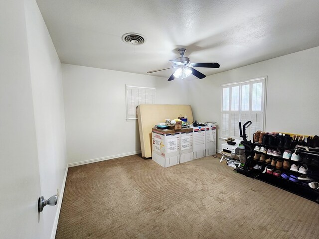 2824 Cimmaron Ave, Midland, TX 79705 - interior space with carpet, a ceiling fan, and baseboards
