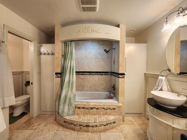 2824 Cimmaron Ave, Midland, TX 79705 - bathroom with toilet, tiled shower / bath, and vanity