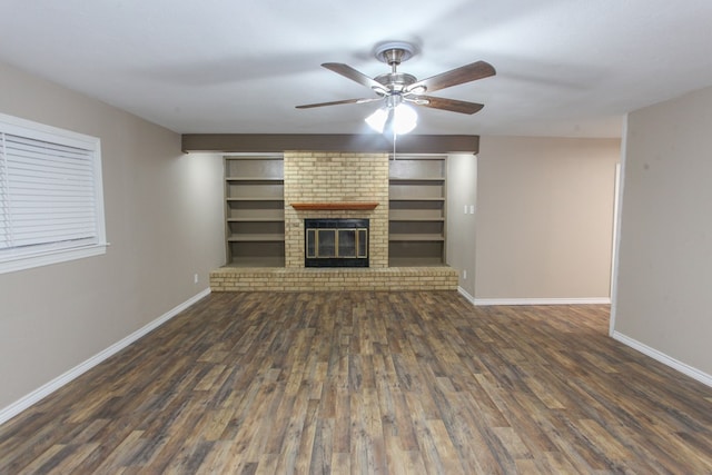 unfurnished living room with a fireplace, ceiling fan, wood finished floors, and baseboards