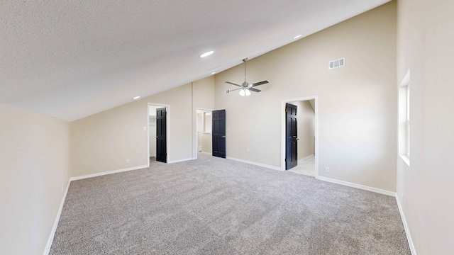 bonus room with ceiling fan, light colored carpet, high vaulted ceiling, and a textured ceiling