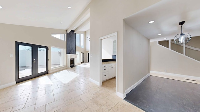 interior space with french doors and a high ceiling