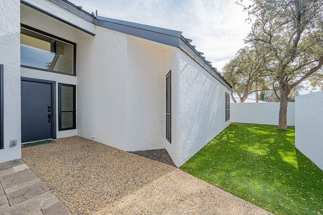 view of side of property with a yard