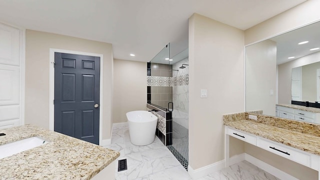 bathroom featuring vanity and independent shower and bath