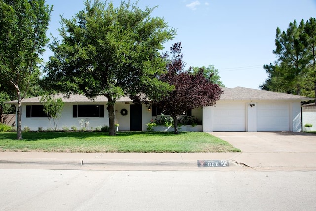 909 Douglas Ave, Midland, TX 79701 - view of front of property with a front lawn and concrete driveway